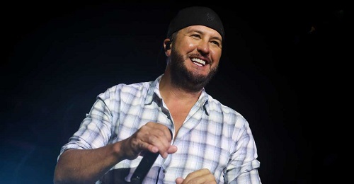 news Luke Bryan slips on fan’s cell phone - tumbles on stage